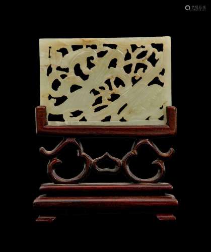 A RETICULATED CHINESE WHITE JADE PLAQUE, MOUNTED ON ROSE WOO...