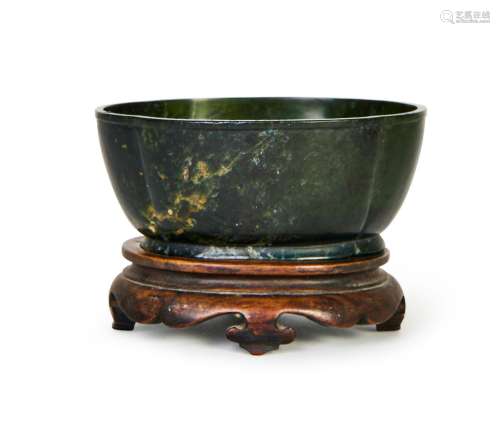 A CHINESE SPINACH JADE BASIN, 18TH CENTURY OR EARLIER