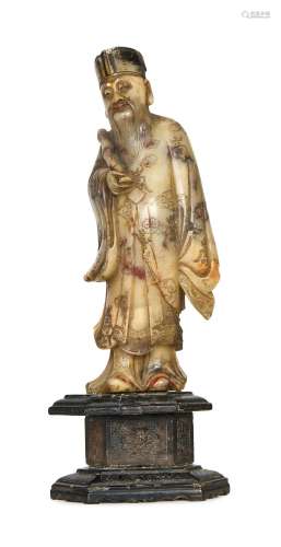 A CARVED CHINESE SOAPSTONE FIGURE, 18TH CENTURY