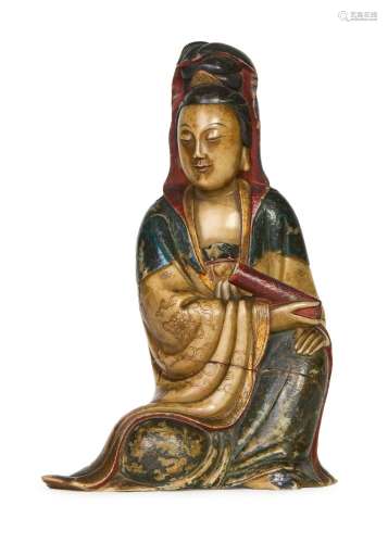 A CARVED CHINESE SOAPSTONE FIGURE OF A GUANYIN, KANGXI PERIO...