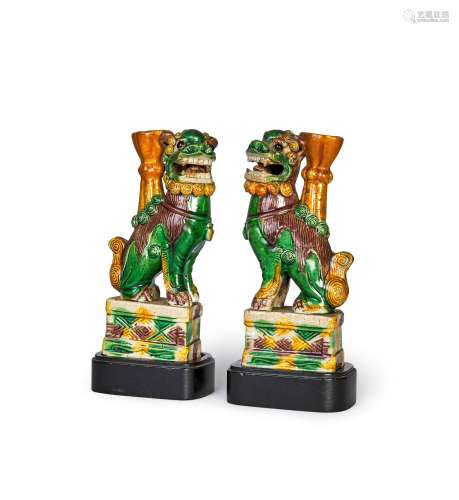 A PAIR OF CHINESE BISCUIT GLAZED FAMILLE VERTE FOO DOGS ON W...