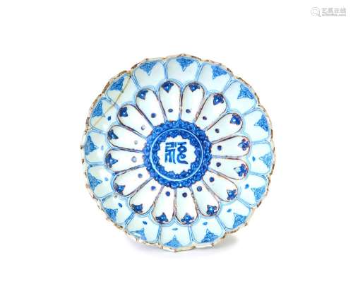 A RARE BLUE AND WHITE AND IRON-RED MOULDED \'LOTUS\' DISH WA...