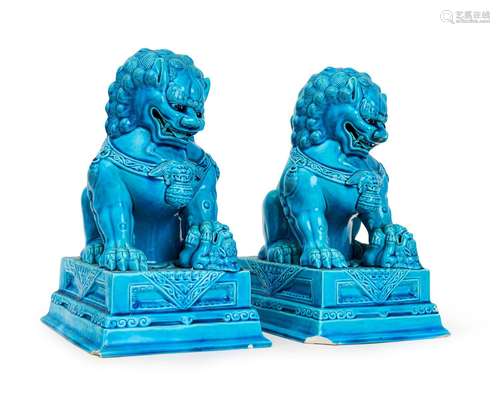 A PAIR OF CHINESE TURQUOISE GLAZED BUDDHIST LIONS, QING DYNA...