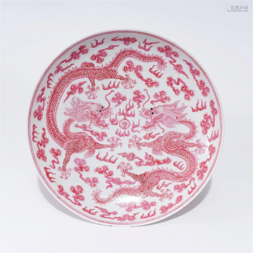 A carmine glaze plate with dragon pattern in the Qing Dynast...