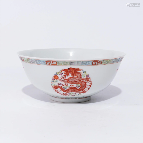 A famille rose bowl with dragon and phoenix patterns in the ...