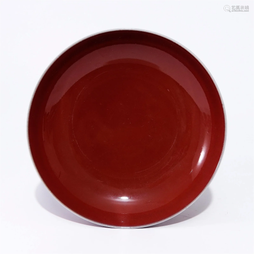 A red glaze plate in the Qianlong period of the Qing Dynasty