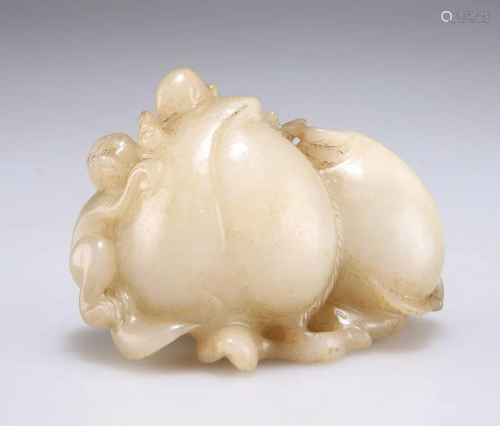 A CHINESE JADE CARVING OF PEACHES AND MONKEY
