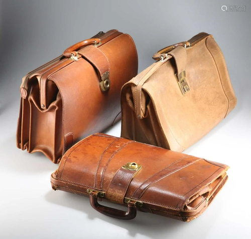 THREE VINTAGE BROWN LEATHER BRIEFCASES