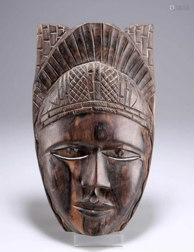 A CARVED TRIBAL MASK