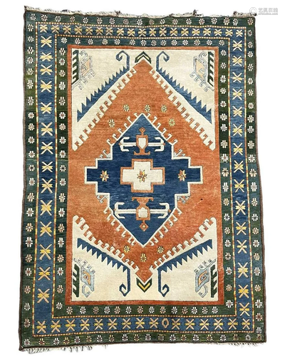 AN ORIENTAL TRIBAL RUG