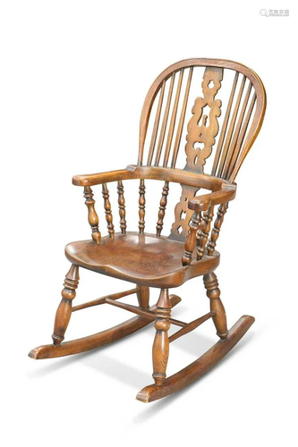 A PERIOD-STYLE ELM AND OAK CHILD'S ROCKING CHAIR