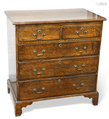 A GEORGE III OAK CHEST OF DRAWERS