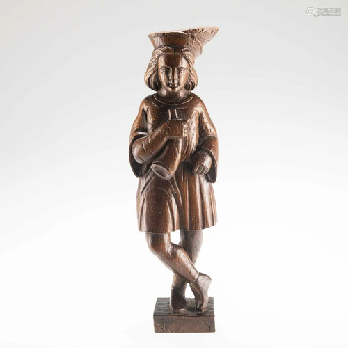 A 19TH CENTURY CARVED OAK FIGURE