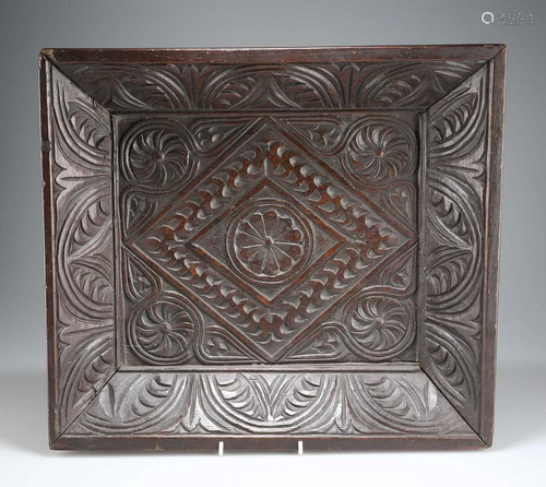 A CARVED OAK TRAY