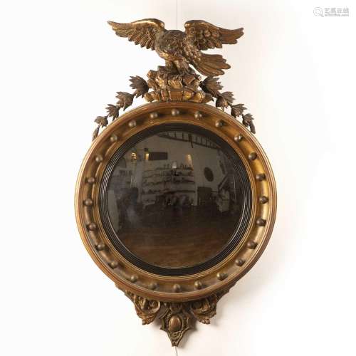 Giltwood convex wall mirror Regency period with carved eagle...
