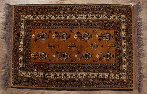 Red ground rug Afghanistan, with elephant foot designs and w...