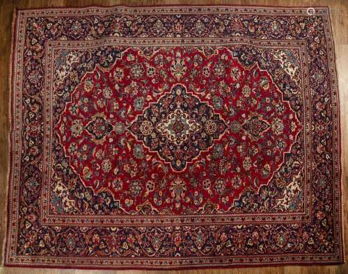Ardekan red and blue ground wool carpet Iranian, with floral...