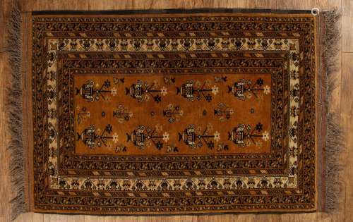 Afghan gold ground rug with traditional panelled designs, 12...