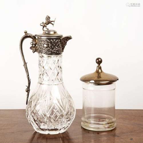 Heavy glass and silver plated claret jug with a lion finial,...