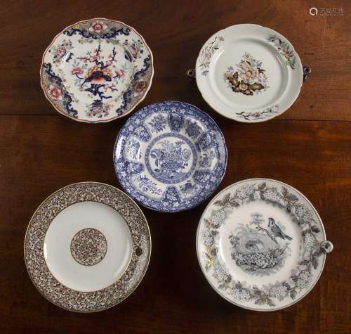 Four ceramic warming plates and a blue and white bowl compri...
