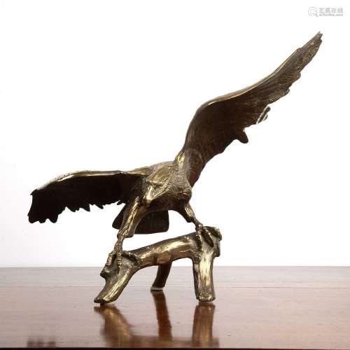 Gilded bronze eagle depicted perched on a tree branch with i...