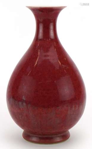 Chinese porcelain vase having a sang de boeuf glaze, six fig...