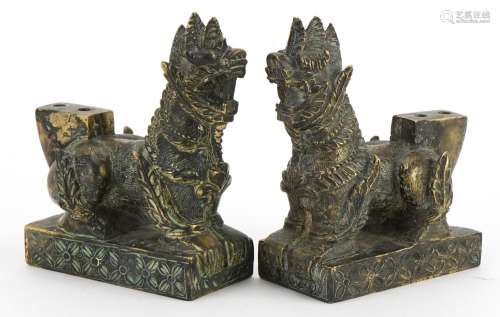 Pair of Chinese patinated bronze guardian dogs, 9.4cm in len...