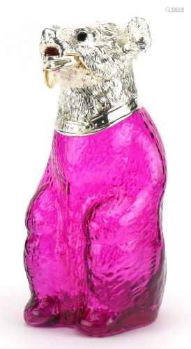 Cranberry coloured glass claret jug in the form of a bear wi...