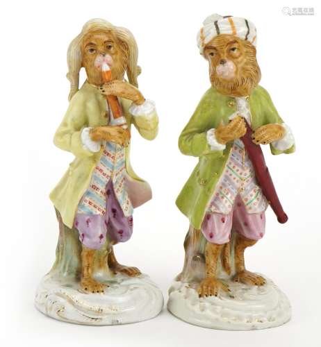 Two German hand painted porcelain monkey band musicians, the...