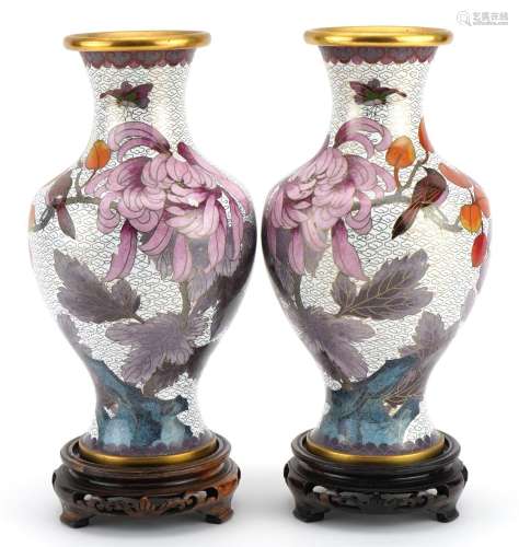 Pair of Chinese cloisonne vases raised on hardwood stands, e...