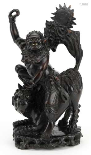 Chinese root carving of a mythical figure and animal, 39cm h...
