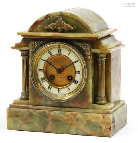 Green onyx mantle clock with brass column supports and mount...