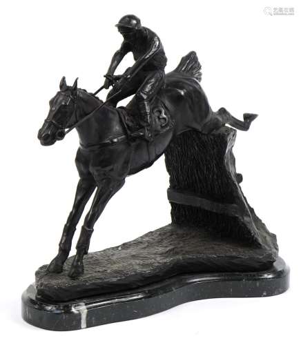 Large patinated bronze study of a jockey on horseback raised...