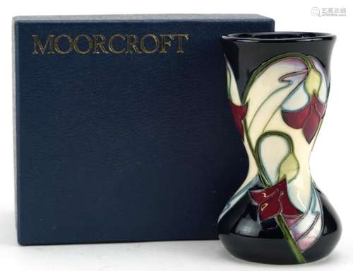 Moorcroft pottery vase hand painted with stylised flowers, d...