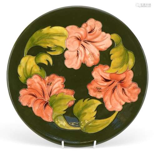 Moorcroft pottery plate hand painted with flowers, signed to...