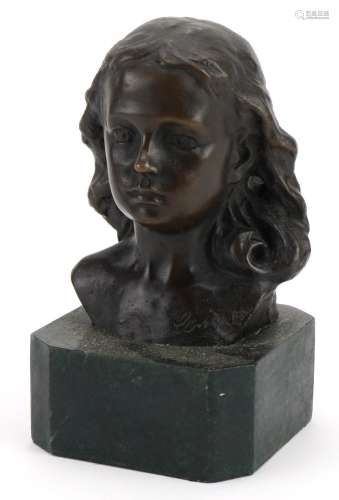 Patinated bronze bust of a female raised on a green marbleis...