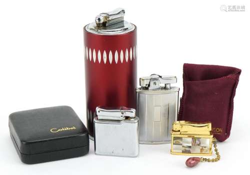 Four vintage pocket and table lighters including Calibre and...
