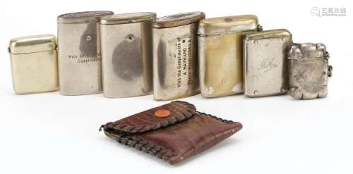 Seven vintage vestas including one silver, the largest 6cm i...