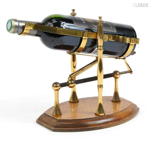 Brass mechanical action wine bottle stand/pourer on wooden b...