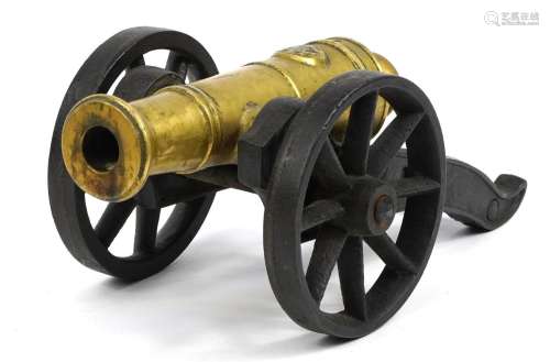 Gilt bronze and cast iron model table cannon, 33cm in length