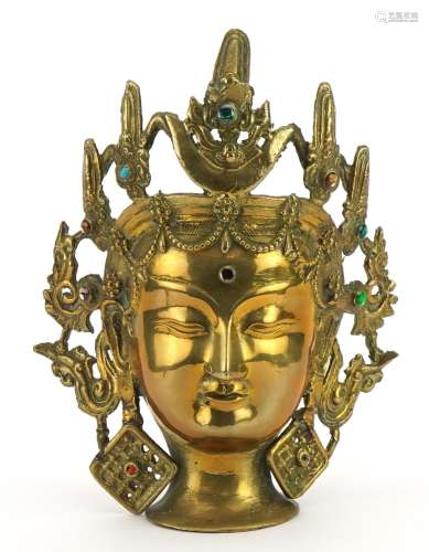 Chinese patinated bronze Buddha head with coloured cabochons...