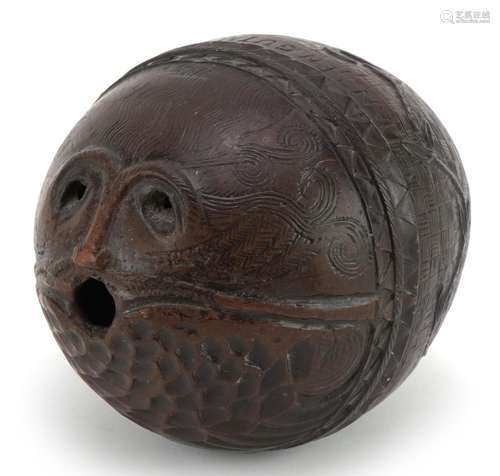 Antique coconut shell carved in the form of a bearded man in...