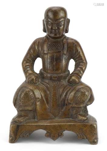 Chino Tibetan bronze figure of a seated warrior, 20.5cm high