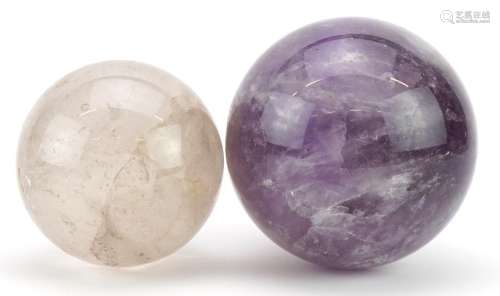Two crystal balls including an amethyst example, the largest...