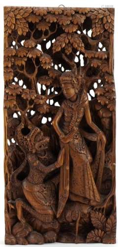 Balinese wooden wall plaque deeply carved in relief with a f...