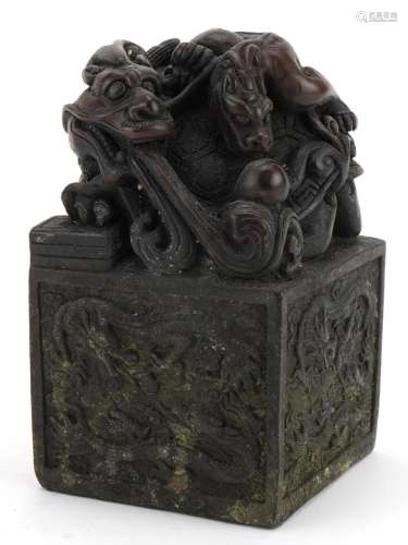 Large Chinese patinated bronze seal decorated with dragons, ...