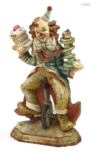Cast iron doorstop in the form of a clown on a unicycle, 32c...