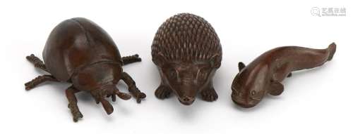 Three Japanese patinated bronze animals comprising hedgehog,...