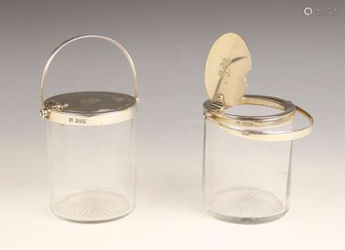 A pair of Edwardian silver mounted cut glass preserve jars, ...