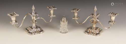 A pair of silver plated three light candelabras, each with s...